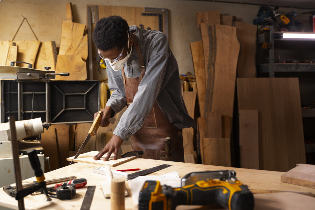 medium shot artisan doing woodcutting (1)